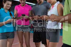 Volleyball players using phones