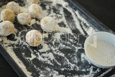 Close up of dough with flour on baking sheet