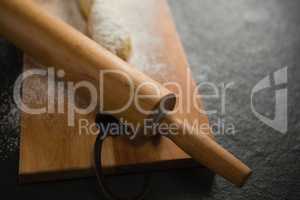 Close up of rolling pin on cutting board