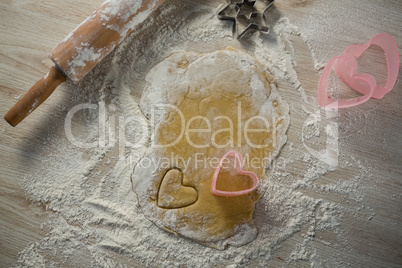 Directly above shot of heart shape cutter on dough