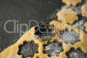 High angle view of flower shape mould on dough