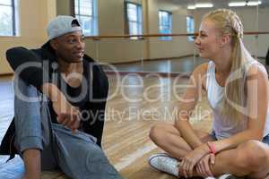 Friends talking in dance studio