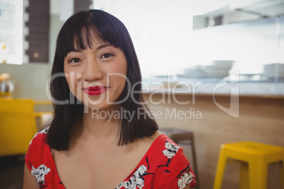 Portrait of young woman in cafe