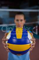 Female sportsperson holding volleyball