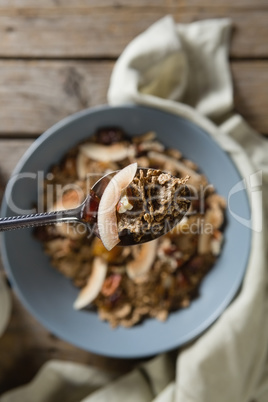 Breakfast cereal in bowl on wooden table