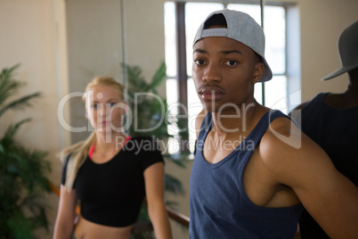 Portrait of male dancer with friend in studio