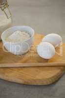 Flour and eggs on cutting board