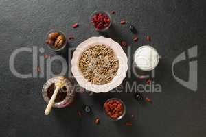 Bowl of cereal bran stick, yogurt, honey and dried fruits