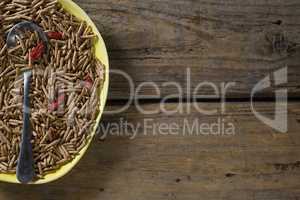 Cereal bran sticks with spoon in plate