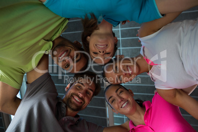 Portrait of smiling volleyball players huddling