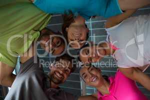 Portrait of smiling volleyball players huddling