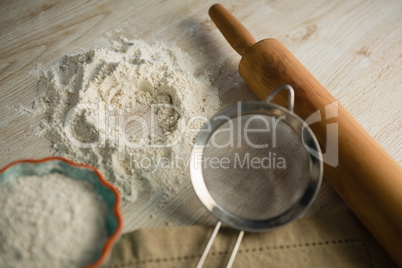 Close up of flour with rolling pin and strainer