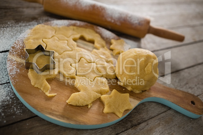 High angle view of dough on cutting board
