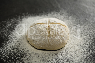 Close up of flour on unbaked bun