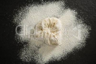 Overhead view of flour on dough