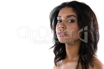 Portrait of confident woman against white background