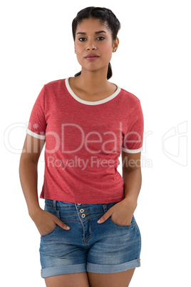 Portrait of beautiful woman with hands in pockets