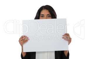Portrait of young businesswoman holding placard