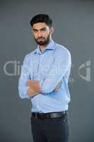 Handsome man posing against grey background