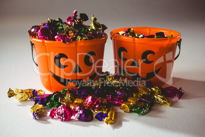 Orange buckets with colorful chocolate