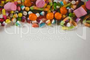 View of various candies over white background