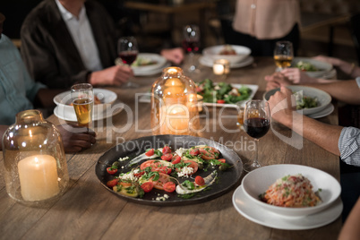 Friends dining in restaurant