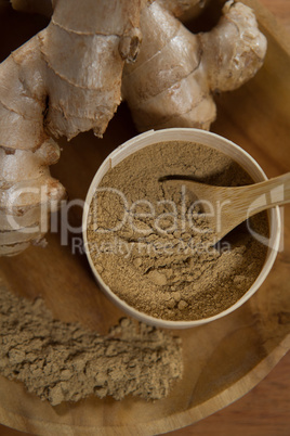 Directly above view of ginger with powder in plate