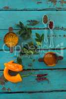 Various spices and herbs on wooden table