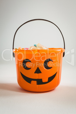 Orange bucket over white background