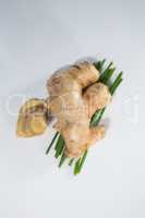 Overhead view of fresh ginger and herb