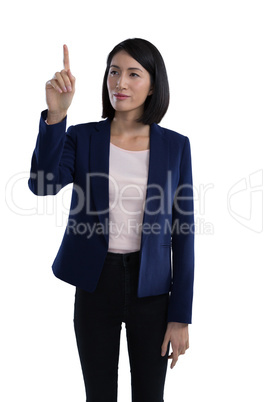 Businesswoman touching invisible screen