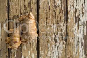 Directly above view of ginger on weathered table