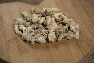 Close up of dried gingers on wooden board