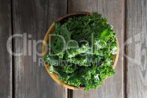 Overhead view of kale in bowl on table