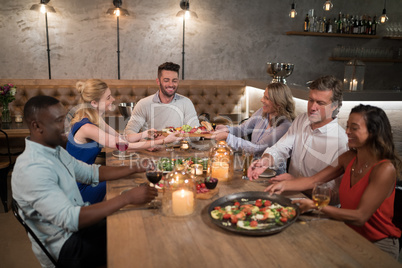 Friends dining together in restaurant