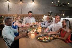 Friends dining together in restaurant