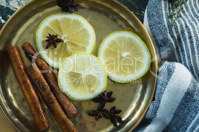 Various spices, spoon and napkin on wooden table