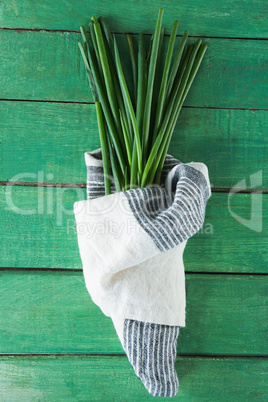 Garlic chives on wooden table