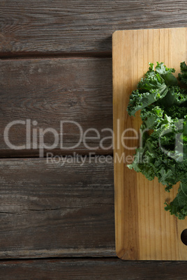 Kale leaves on wooden board