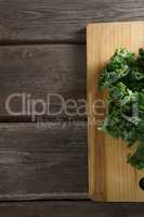 Kale leaves on wooden board