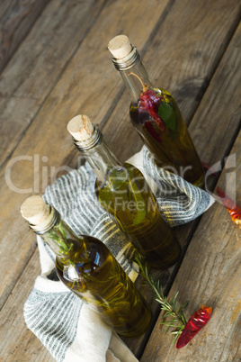 Olive oil bottles with herbal and spices