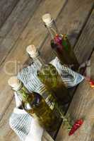 Olive oil bottles with herbal and spices