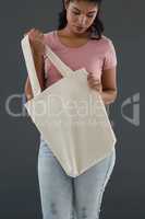 Woman holding shoulder bag