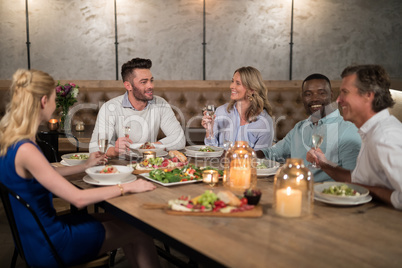 Friends dining together in restaurant