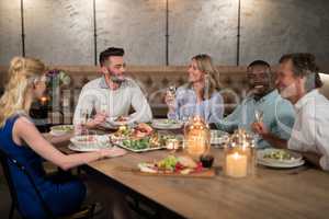 Friends dining together in restaurant