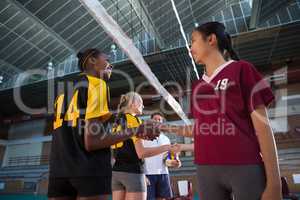 Female players shaking hands after match