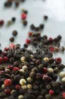 Mix peppercorns on white background