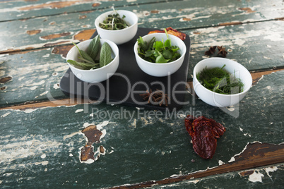 Spices and herbs on wooden table