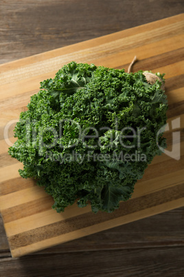 Fresh kale leaves on cutting board