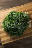 Fresh kale leaves on cutting board